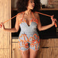Playful Distressed Denim Romper with Orange Rope