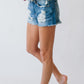 Distressed Mid Rise Frayed Hem Denim Shorts
